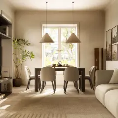 Un soggiorno con un tavolo da pranzo in stile japandi, sedie color crema, una libreria e un divano accogliente.