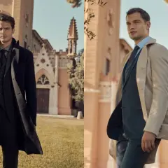 Uomini eleganti in abiti scuri e chiari davanti a un edificio storico. Il nero è un colore caldo o freddo? Dipende dallo stile.