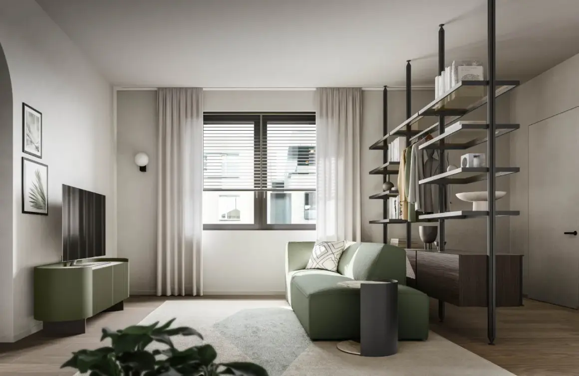 Divano angolare e mobile TV in un rilassante verde salvia colore, con scaffalatura a vista e un'elegante porta.