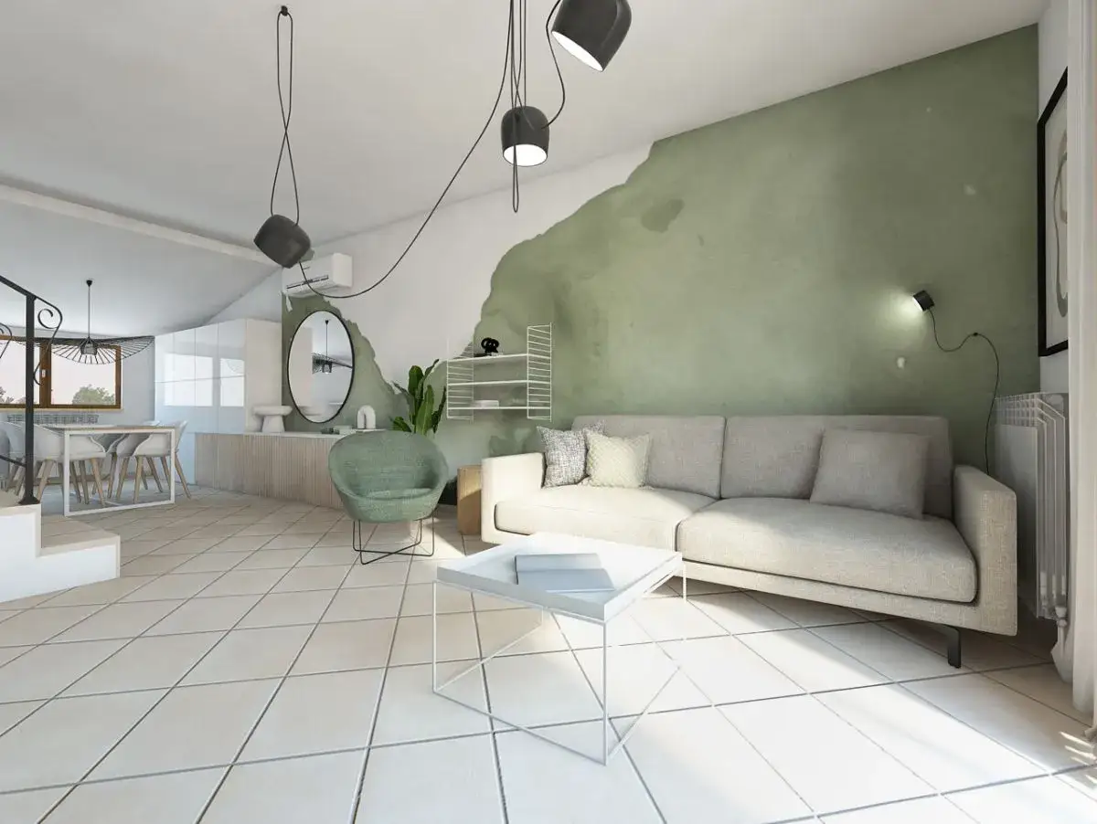 Soggiorno moderno con parete verde, un divano chiaro e un tavolino bianco. Il verde colore caldo o freddo crea un'atmosfera rilassante.