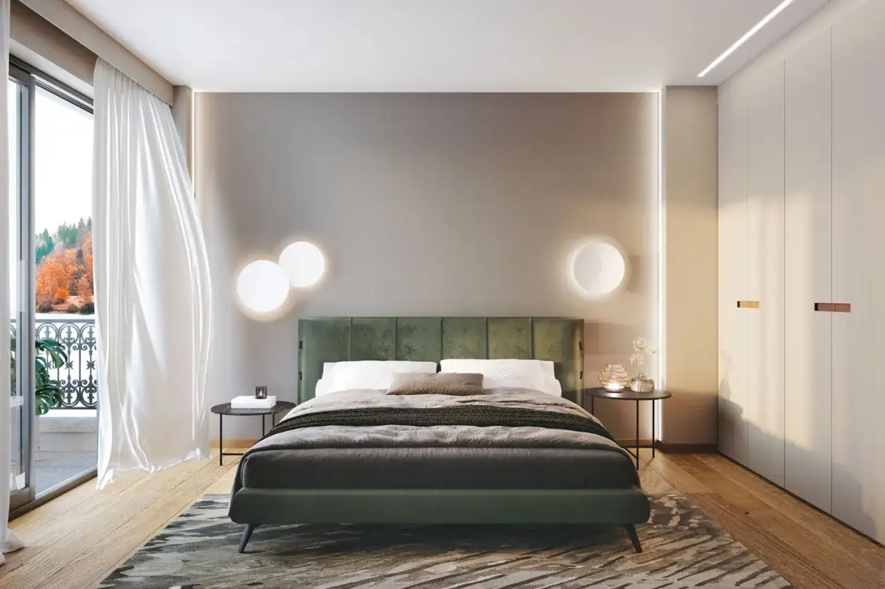 Elegante pittura camera da letto con letto verde, luci soffuse e vista su un paesaggio autunnale.