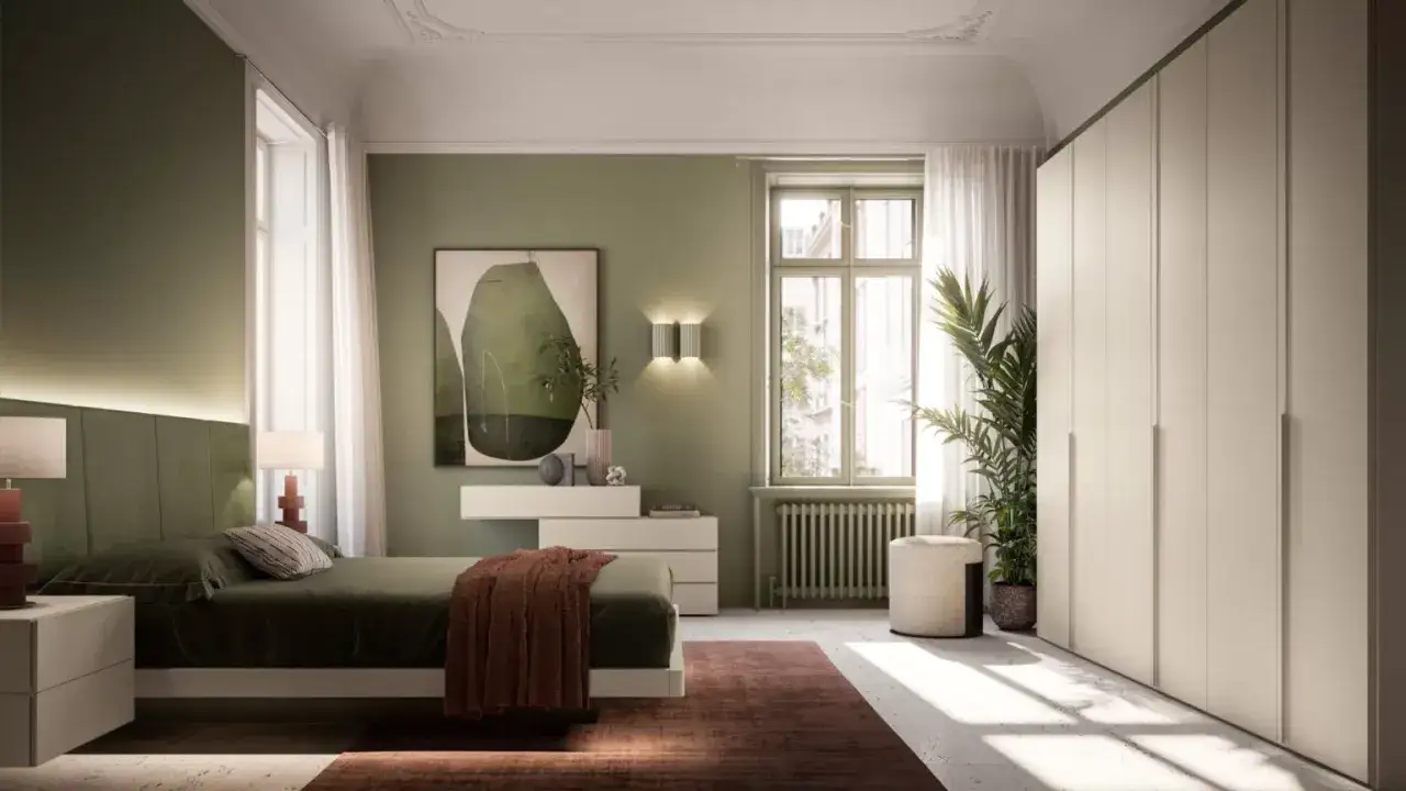 Camera da letto con un elegante abbinamento verde e tortora. Pareti verdi, letto con testiera imbottita, armadio tortora e dettagli in terracotta.