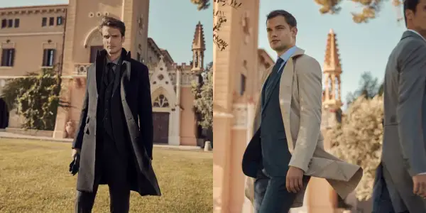 Uomini eleganti in abiti scuri e chiari davanti a un edificio storico. Il nero è un colore caldo o freddo? Dipende dallo stile.