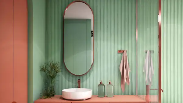 Bagno moderno con pareti verdi a coste e arredi color corallo. Ottime idee rivestimento bagno piccolo con specchio ovale e lavabo a ciotola.